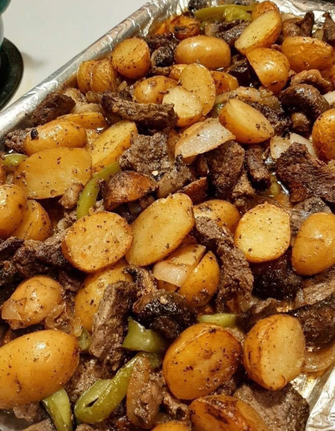 SKILLET WITH GARLIC BUTTER STEAK AND POTATOES