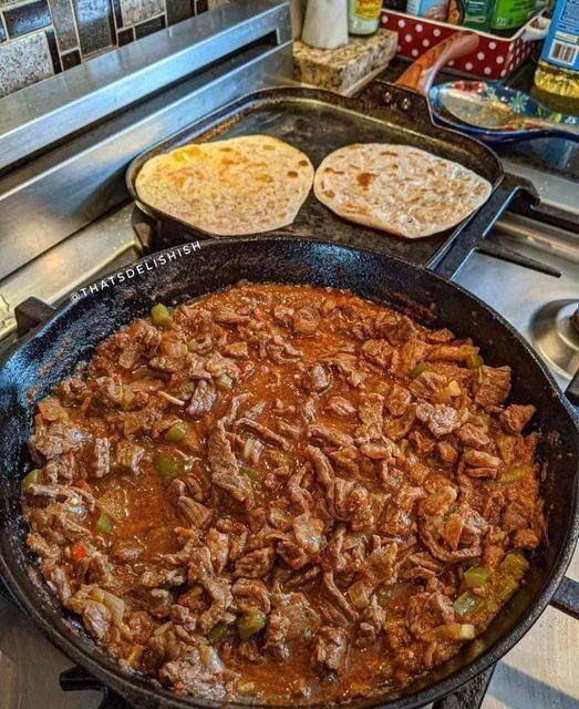 Carne Guisada accompanied by floor tortillas