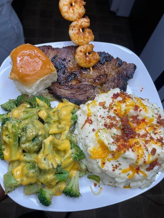 Homemade Mashed Potatoes topped with Cheesy Broccoli, Steak, and Garlic Shrimp