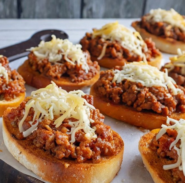 Open Faced Cheesy Sloppy Joes on Garlic Bread